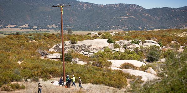 Service techs installing pole